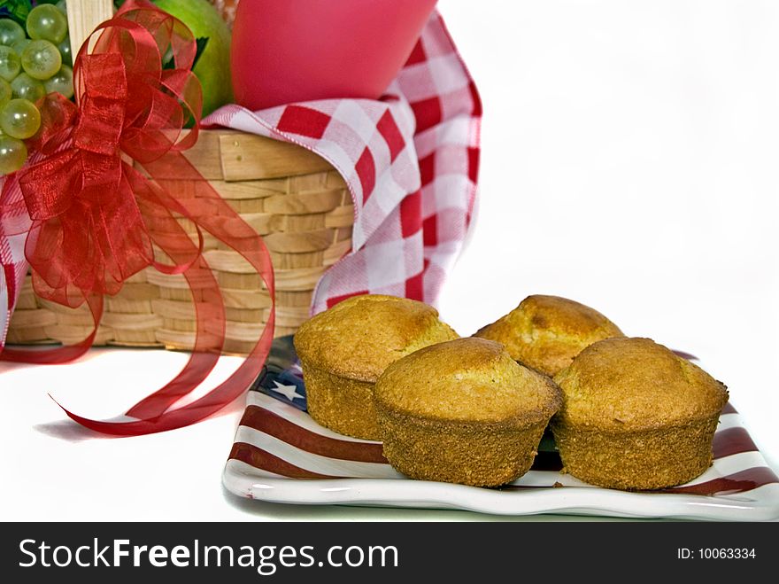 Corn muffins on a flag plate with picnic basket. Corn muffins on a flag plate with picnic basket.