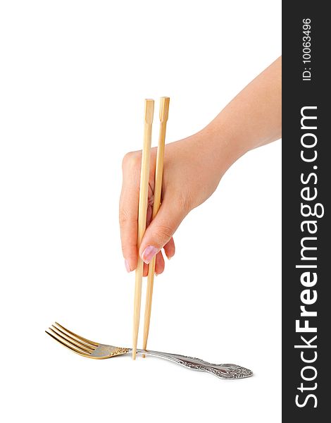 Hand with chopsticks and fork isolated on white background