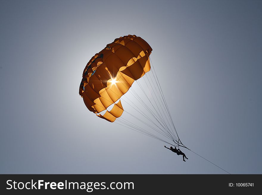 The young woman flies on a parachute. The young woman flies on a parachute