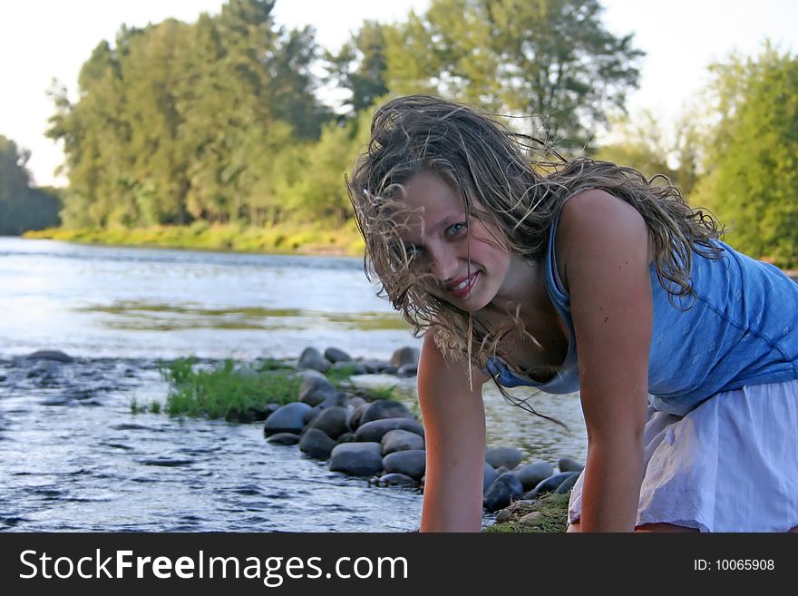 Beautiful young girl with long, brown hair in the river. Beautiful young girl with long, brown hair in the river