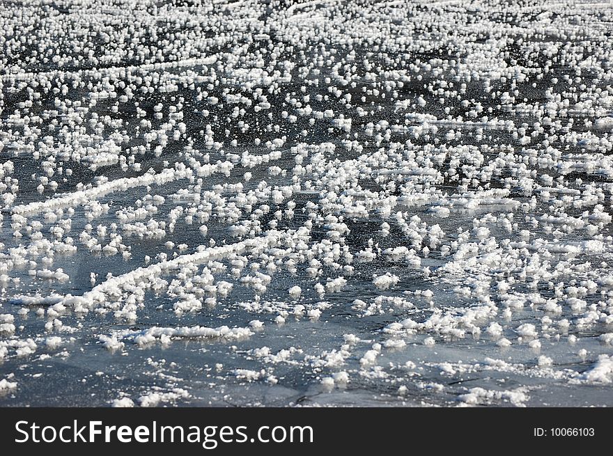 Frozen ice crystals on a lake. Close up and fill frame.