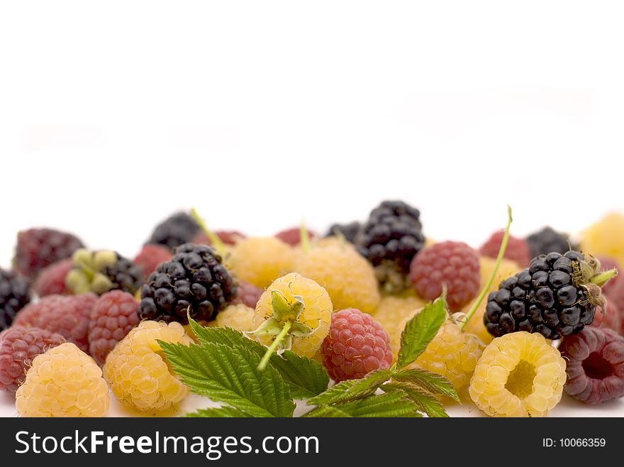 Bright raspberry with leaves on white background