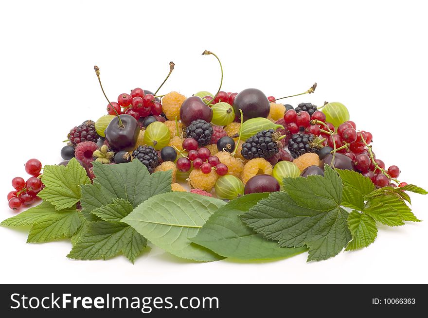 Bright raspberry, currant, gooseberry and cherry with leaves on a white background