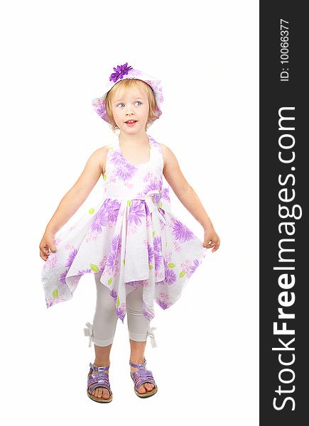 Caucasian cute little girl wearing a purple summer dress and heat dancing, isolated on white background. Caucasian cute little girl wearing a purple summer dress and heat dancing, isolated on white background.