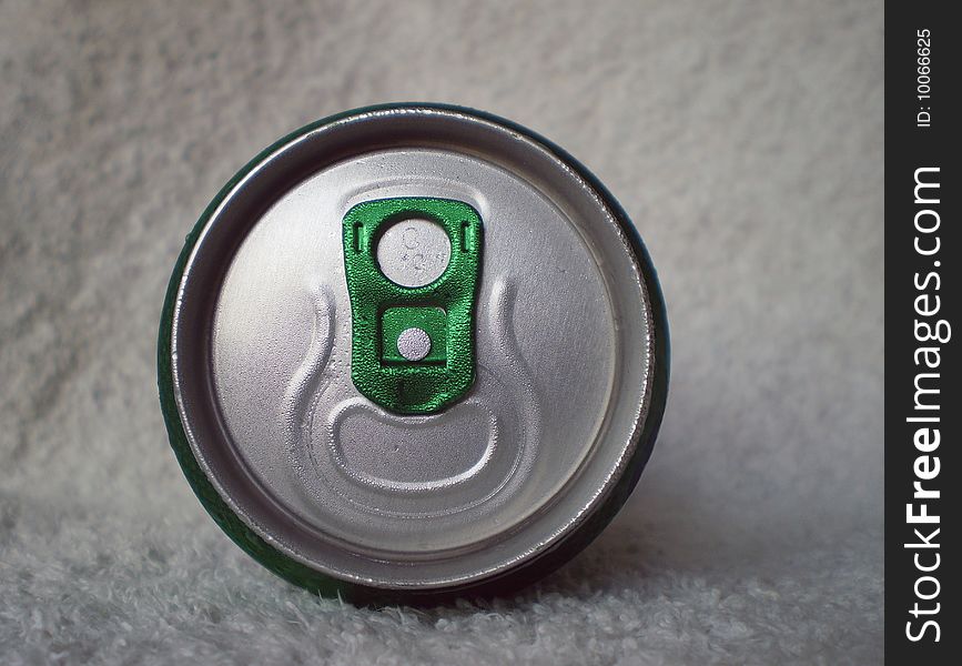 Close up view of the top of a fresh can on a white background