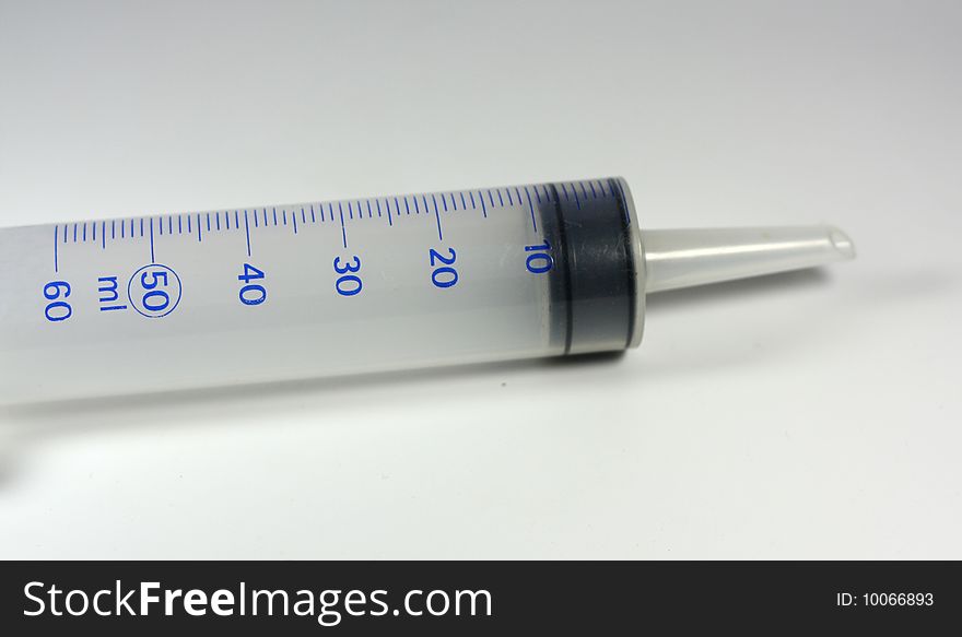 A big syringe with plain background