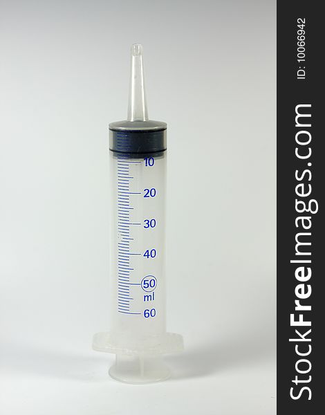 A big syringe with plain background