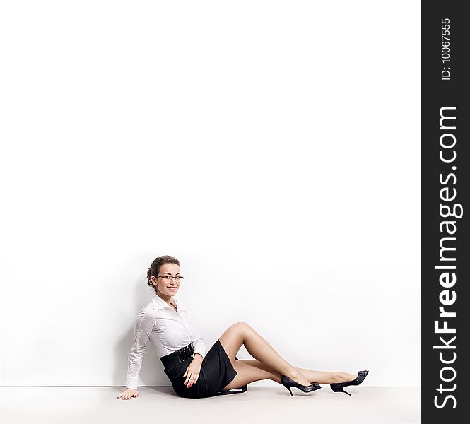 Businesswoman under an empty white board