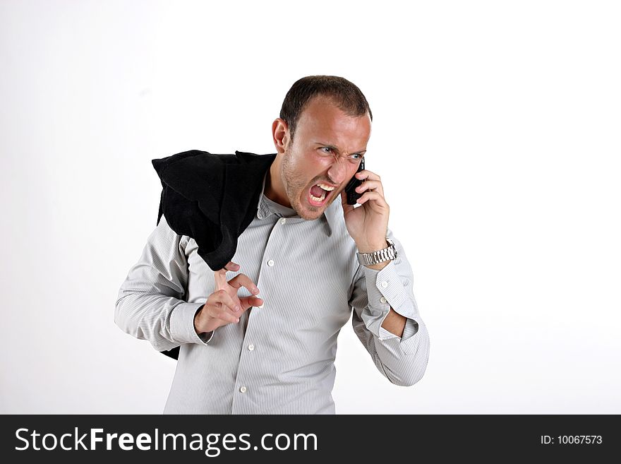 Businessman in black yelling at phone