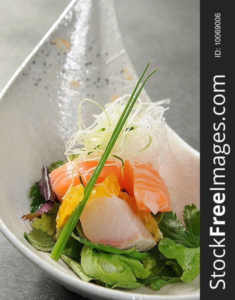 Japanese sashimi on a white dish