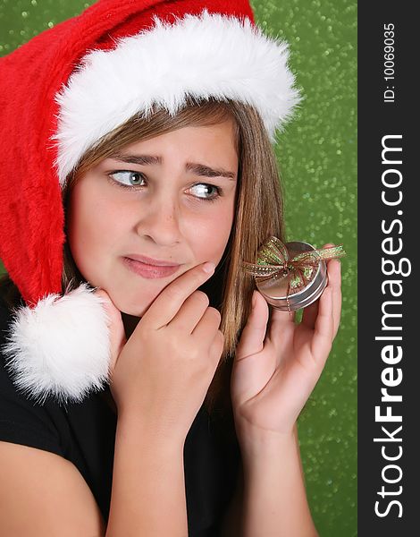 Beautiful teenager girl wearing a christmas hat. Beautiful teenager girl wearing a christmas hat