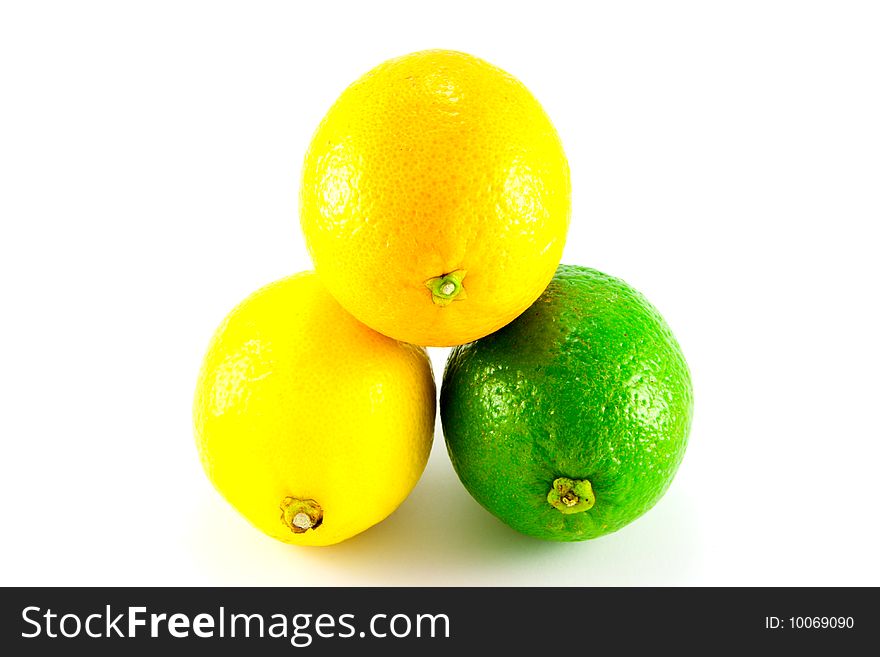 Single whole lemon, Lime and Orange on a white background