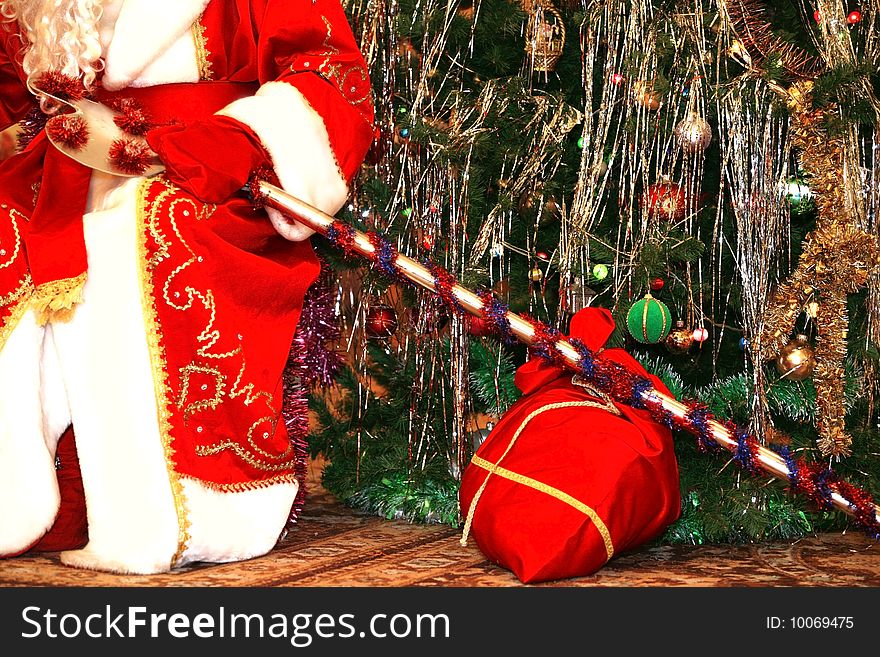 Santa at christmas tree with gifts. Santa at christmas tree with gifts