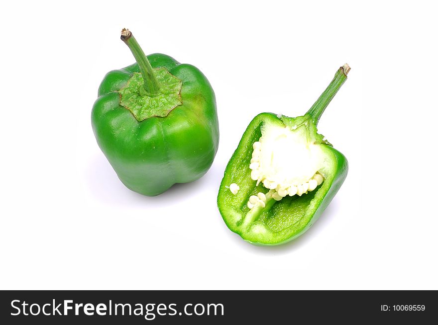 Green capsicums isolated on white background.