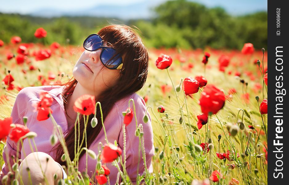 Pretty girl with red flowers