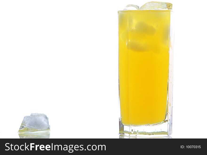 Glass of cold orange juice with ices. Glass of cold orange juice with ices