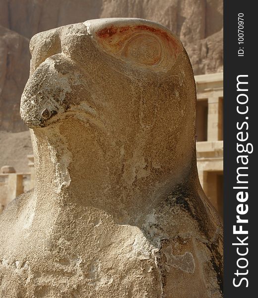 Stone statue of Horus at entrance to temple complex