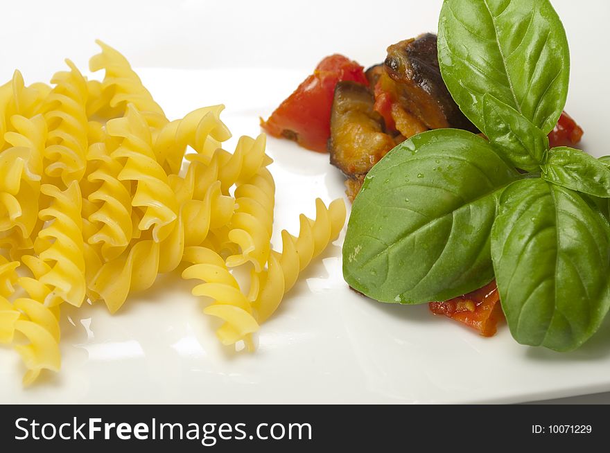 Italian pasta with aubergines, tomatoes and basil
