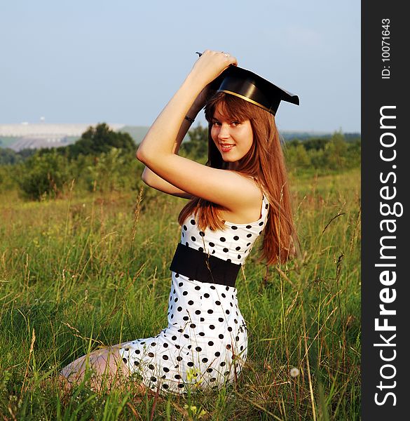 The graduate girls' portrait in a countryside (Lithuania).