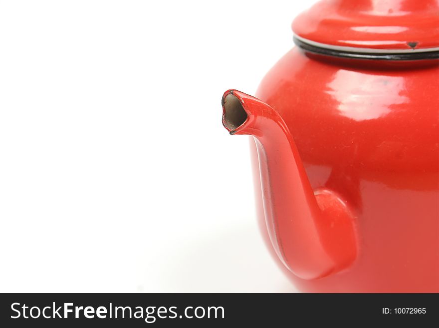 Detail of red metal teapot isolated on white background (sharpen point on pipe). Detail of red metal teapot isolated on white background (sharpen point on pipe)