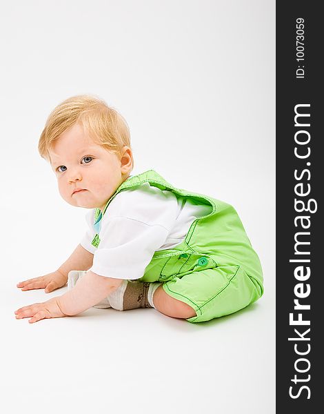 Little baby boy in green a pair of trousers