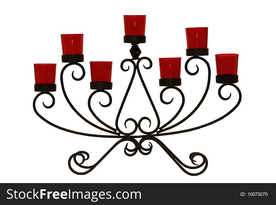 Photo of black steel candlestick with seven red glasses isolated over white background