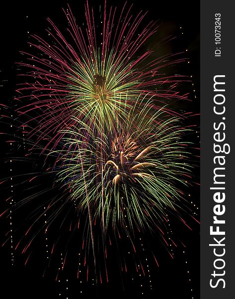 A beautiful full frame fireworks burst background, vertical. A beautiful full frame fireworks burst background, vertical