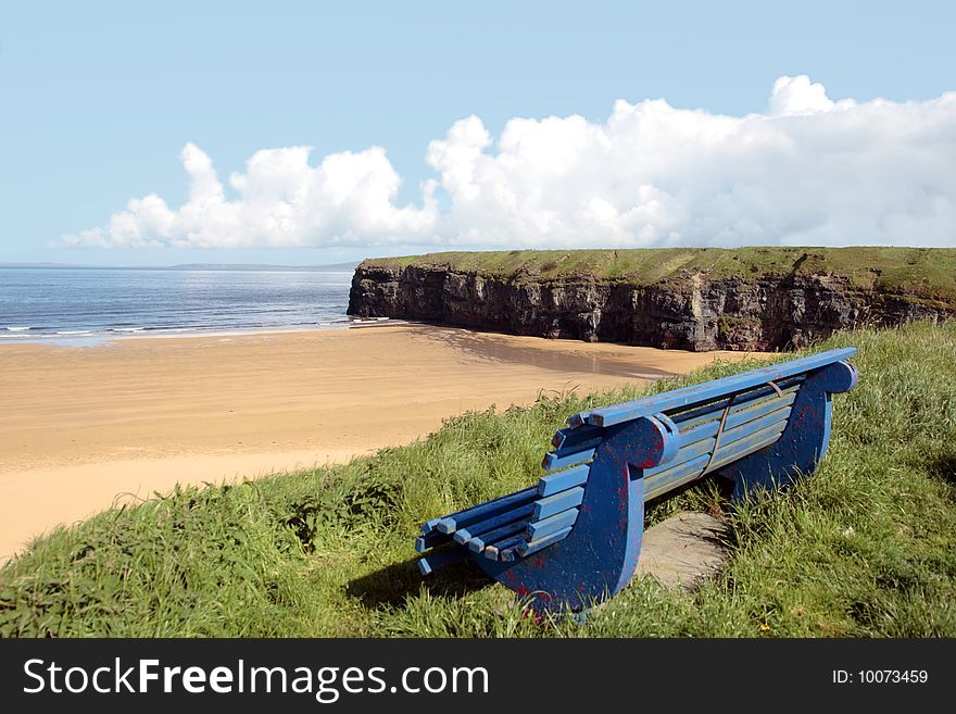 Ballybunion bench with view of beach and cliffs. Ballybunion bench with view of beach and cliffs