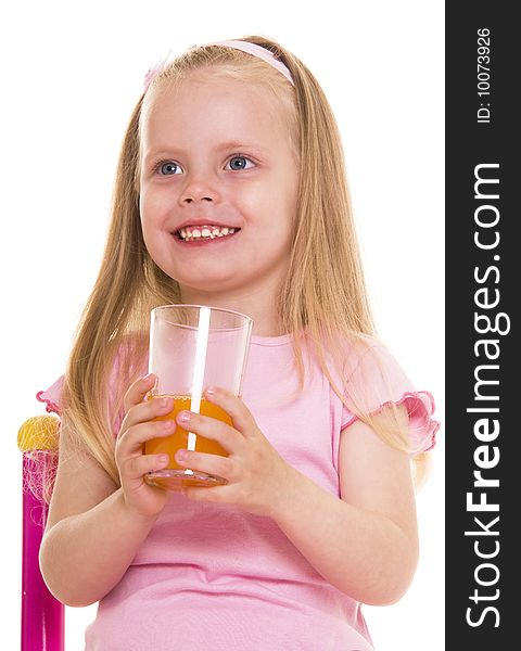Little girl with glass of juice on white. Little girl with glass of juice on white.
