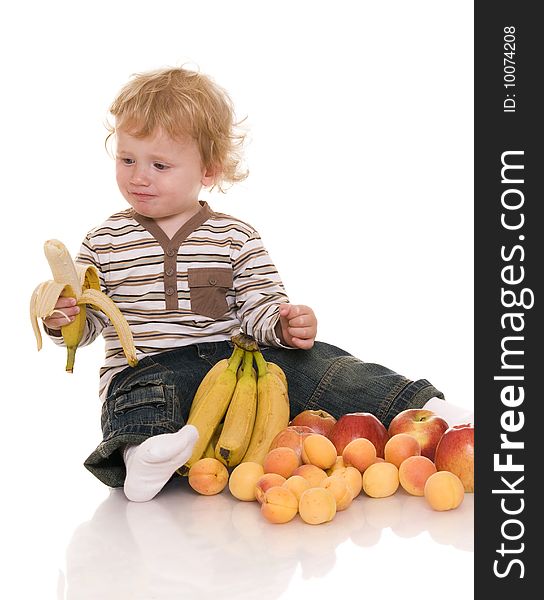 Baby with fruit isolated on white. Baby with fruit isolated on white.