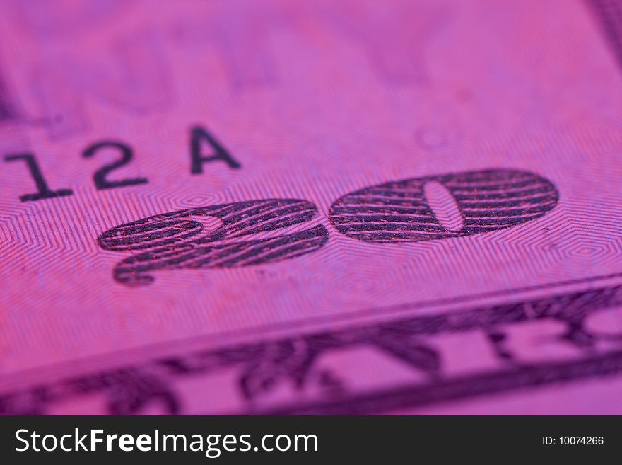Macro 20 dollar bill with pink tint