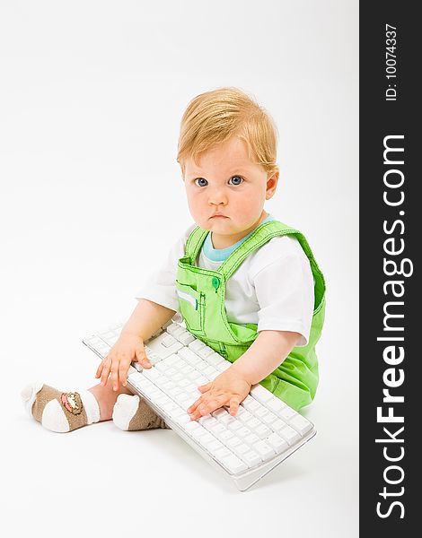 Baby with white keyboard