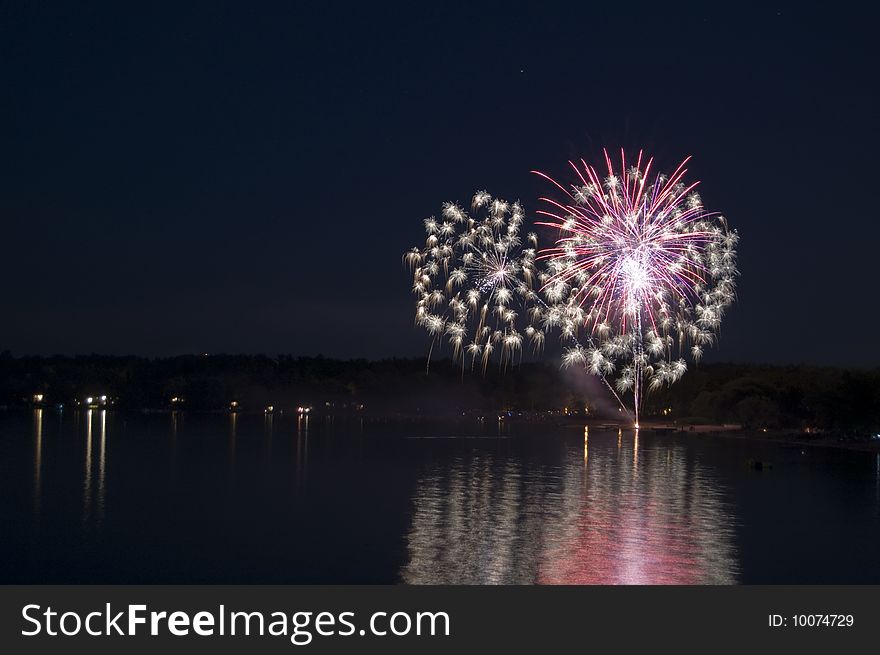Fireworks Exploding Over the Water. Fireworks Exploding Over the Water