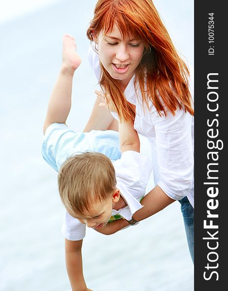 Mother And Son On Beach