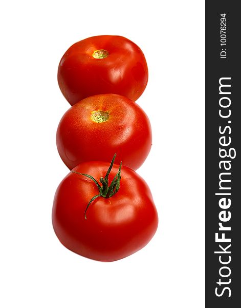 Three fresh tomatoes, isolated on the white. Three fresh tomatoes, isolated on the white