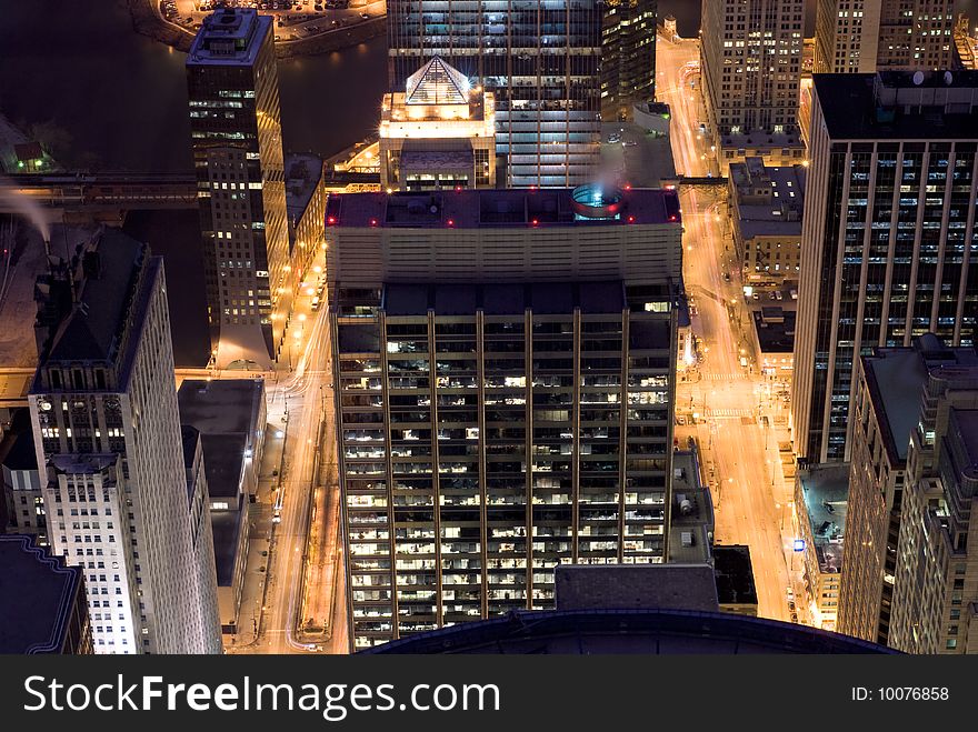 Streets and buildings in downtown Chicago at night. Streets and buildings in downtown Chicago at night