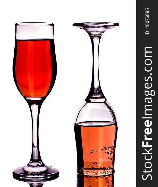 Two glasses with wine on a white background with reflexio