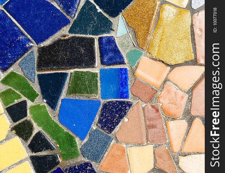 Abstract mosaic pattern with green, blue, and yellow tiles. Abstract mosaic pattern with green, blue, and yellow tiles