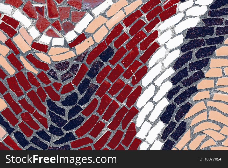 Red, black, and white mosaic tiles in abstract wave design. Red, black, and white mosaic tiles in abstract wave design