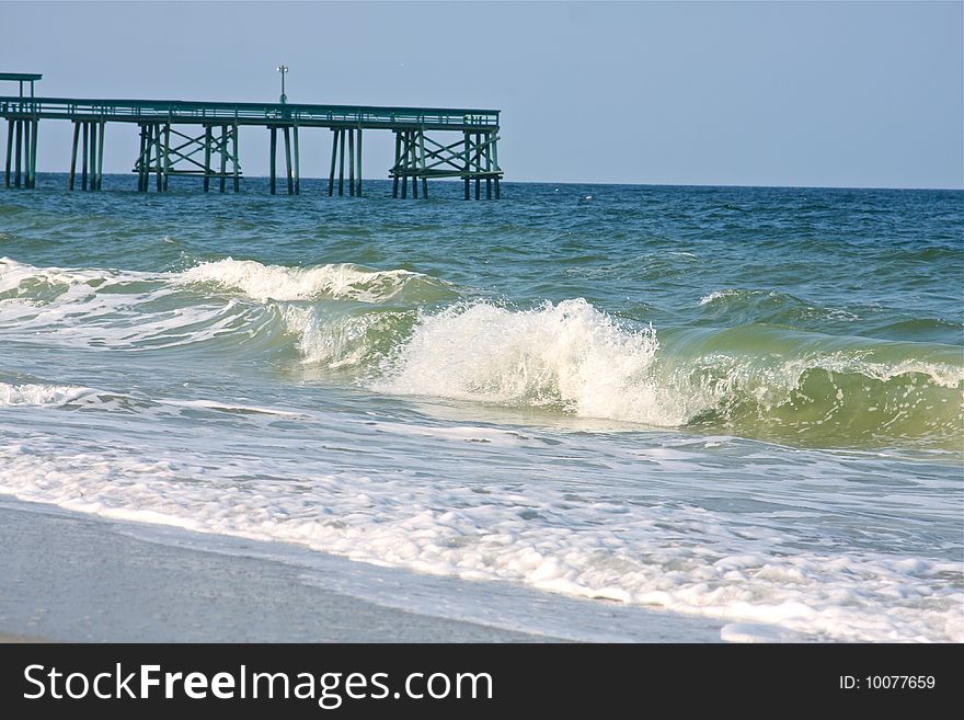Ocean view of beach with pier