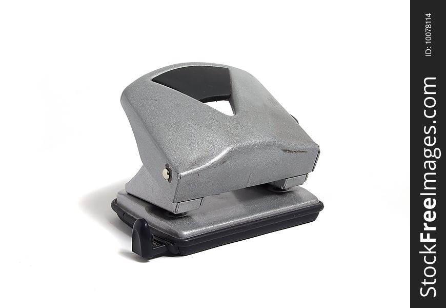 Hole puncher over white background