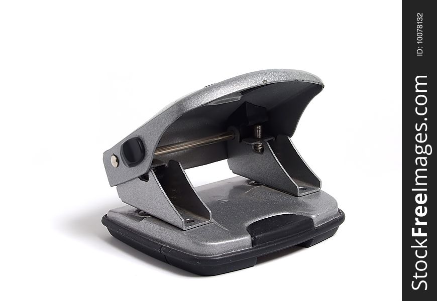 Hole puncher over white background