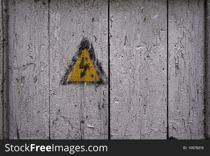 Sign--A high voltage--on an old door