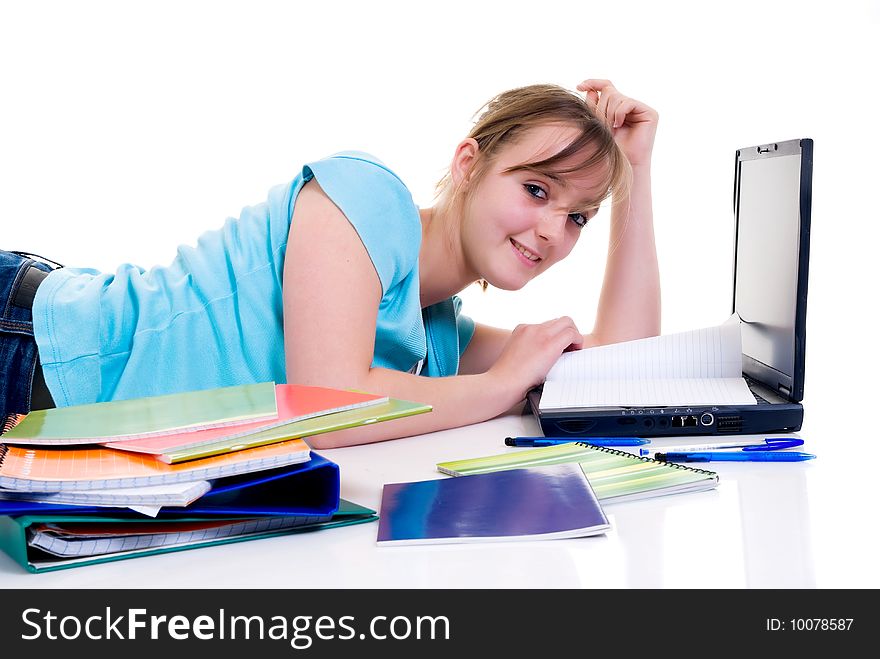 Teenager schoolgirl with laptop on white background