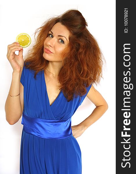 Red-haired girl with lemon segment in her arm on white backround. Red-haired girl with lemon segment in her arm on white backround