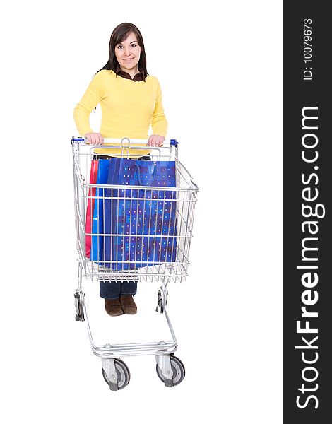 Happy young woman with shopping cart