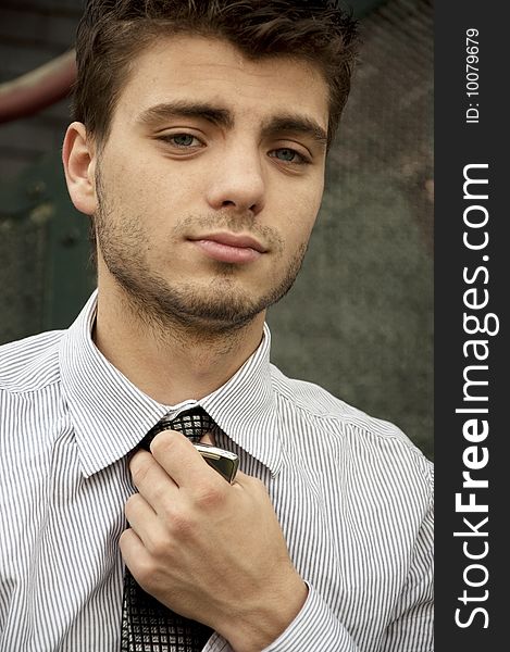 Young handsome man with tie and cell-phone