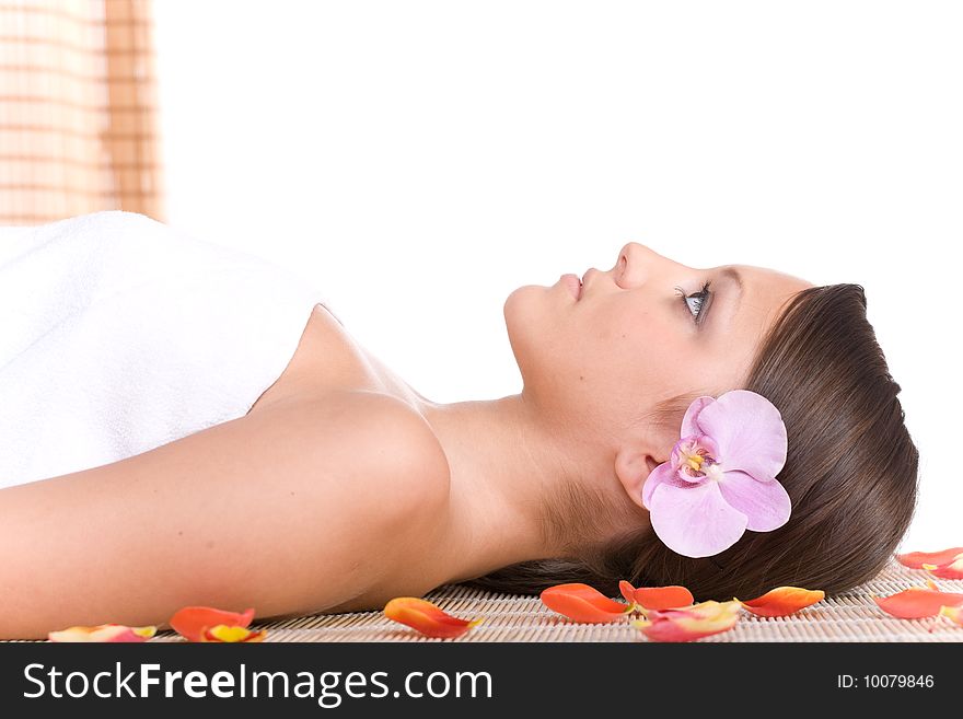 Young woman relaxing in massage. Young woman relaxing in massage