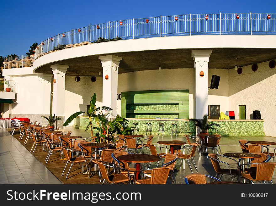 Tables and chairs of outdoor cafe