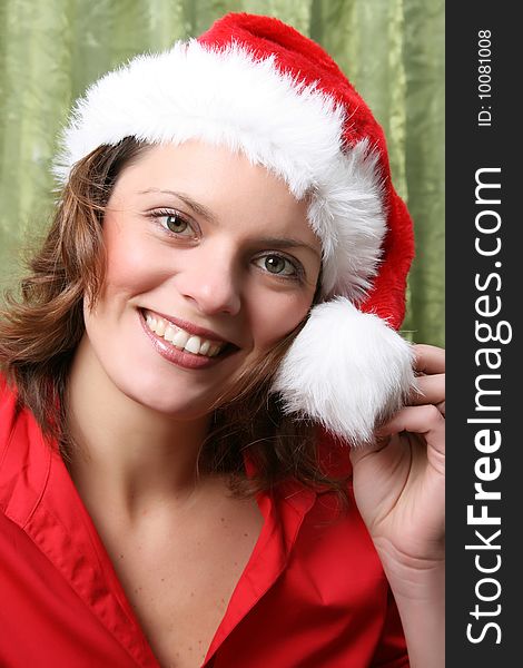 Beautiful Brunette model with a christmas hat and red top. Beautiful Brunette model with a christmas hat and red top